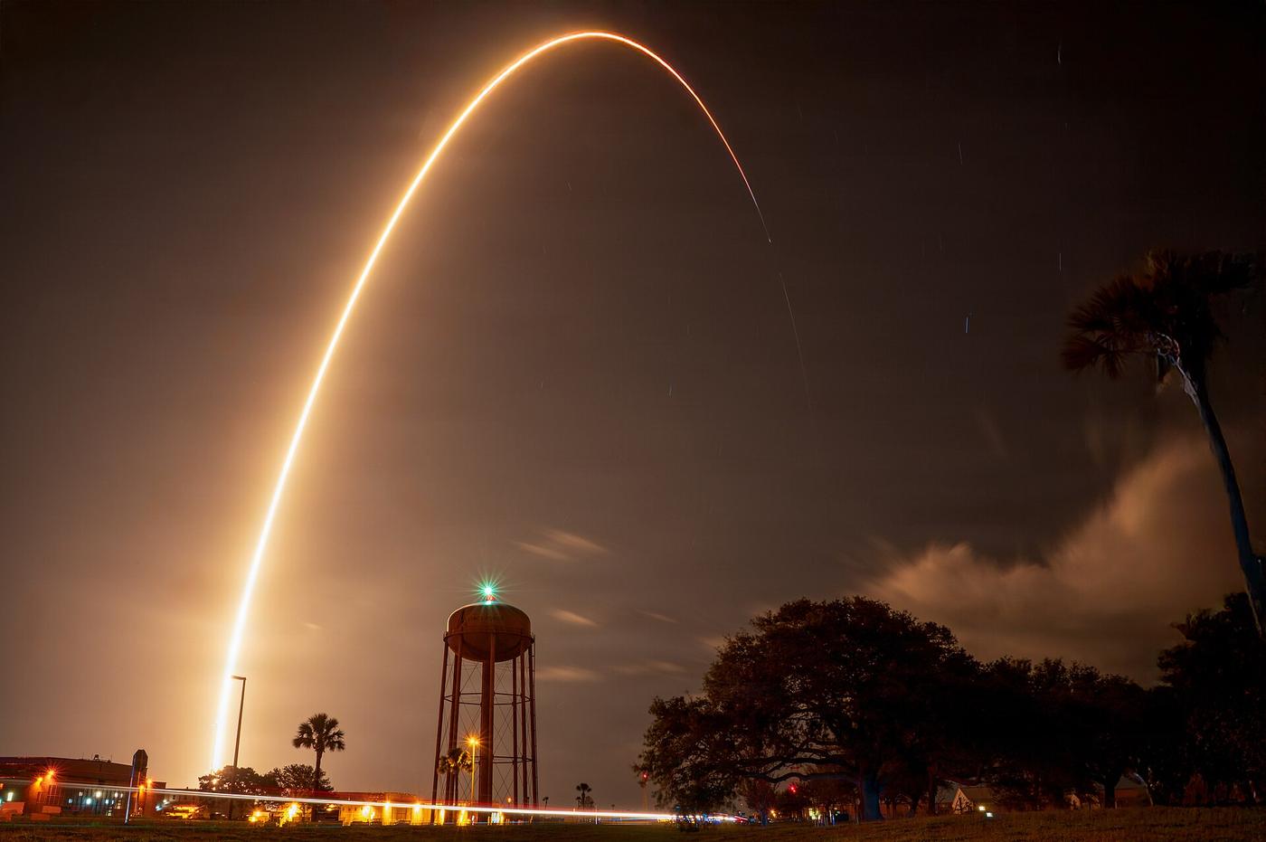 Long-exposure arc of a GPS III satellite launch from Cape Canaveral Space Force Station at night